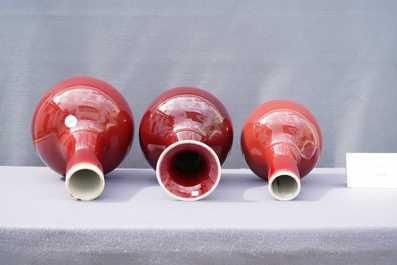 Three Chinese monochrome sang de boeuf-glazed bottle vases, 19/20th C.