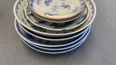 Eighteen Chinese blue and white saucers, seven cups, two dishes and a tea caddy, Kangxi/Qianlong