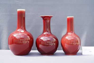 Three Chinese monochrome sang de boeuf-glazed bottle vases, 19/20th C.