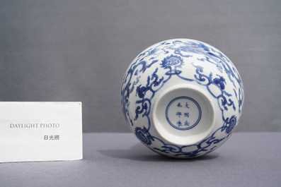A Chinese blue and white 'dragon' bowl with a double vajra in the centre, Chenghua mark, Kangxi