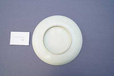 A Chinese monochrome celadon underglaze 'dragon' dish, Qianlong/Jiaqing
