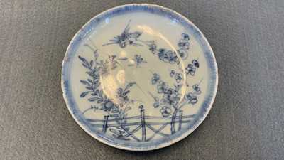 Eighteen Chinese blue and white saucers, seven cups, two dishes and a tea caddy, Kangxi/Qianlong