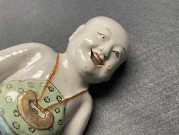 A Chinese famille verte water dropper modelled as a peeing boy, Qianlong