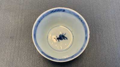 Eighteen Chinese blue and white saucers, seven cups, two dishes and a tea caddy, Kangxi/Qianlong