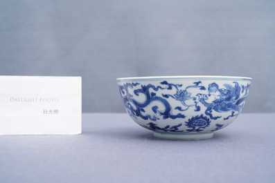 A Chinese blue and white 'dragon' bowl with a double vajra in the centre, Chenghua mark, Kangxi