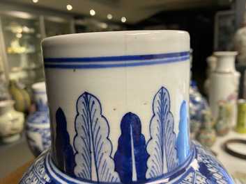 A pair of Chinese blue and white vases and a famille rose jar and cover, 19/20th C.