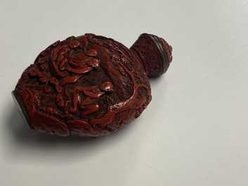 A Chinese carved red cinnabar lacquer 'boys at play' snuff bottle, imperial workshops, Qianlong/Jiaqing