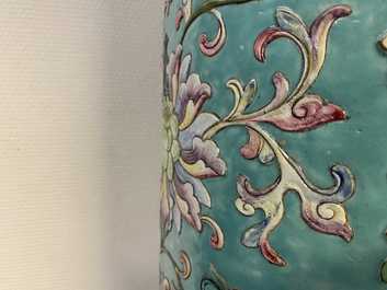 A large Chinese famille rose cylindrical vase with molded lotus scrolls, Jiaqing/Daoguang