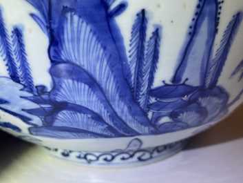 A large Chinese blue and white 'river landscape' bowl, Ming