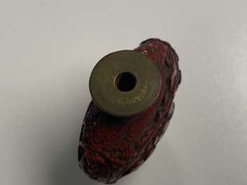 A Chinese carved red cinnabar lacquer 'boys at play' snuff bottle, imperial workshops, Qianlong/Jiaqing