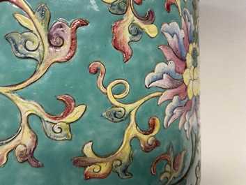 A large Chinese famille rose cylindrical vase with molded lotus scrolls, Jiaqing/Daoguang