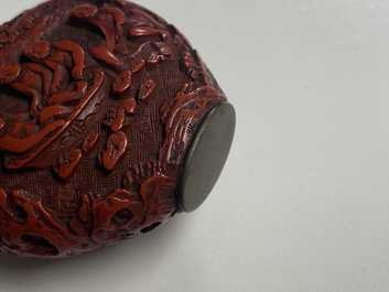 A Chinese carved red cinnabar lacquer 'boys at play' snuff bottle, imperial workshops, Qianlong/Jiaqing