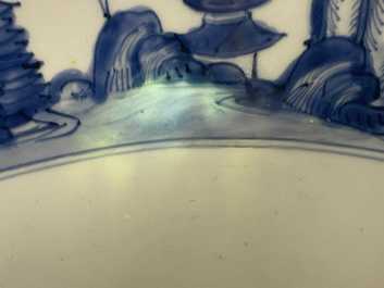 A large Chinese blue and white 'river landscape' bowl, Ming