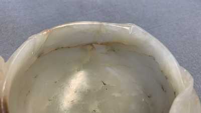 A Chinese mottled celadon and brown jade peach-form brush washer, Qing