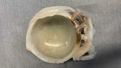 A Chinese mottled celadon and brown jade peach-form brush washer, Qing