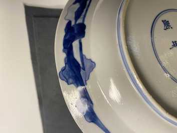 Five Chinese blue and white figurative plates, Kangxi and Chenghua marks, Kangxi
