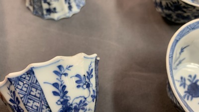 Six Chinese blue and white cups and saucers and eleven miniature vases, Kangxi