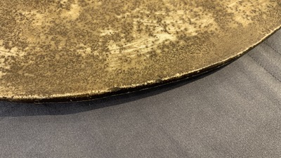 A large Chinese round blue and white plaque with floral design, 19th C.