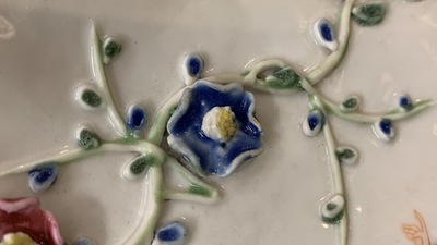 Een paar Chinese famille rose schotels met reli&euml;fdecor, Yongzheng