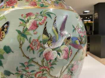 A pair of large Chinese Canton famille rose celadon-ground vases and covers, 19th C.