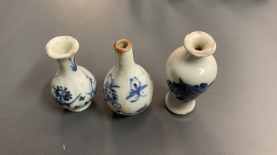 Six Chinese blue and white cups and saucers and eleven miniature vases, Kangxi
