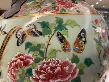 A pair of large Chinese Canton famille rose celadon-ground vases and covers, 19th C.