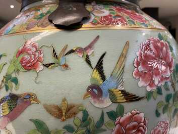 A pair of large Chinese Canton famille rose celadon-ground vases and covers, 19th C.