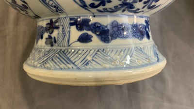 A Chinese blue and white bottle vase with flower arrangements, Kangxi