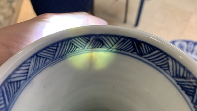 A Chinese blue and white bottle vase with flower arrangements, Kangxi