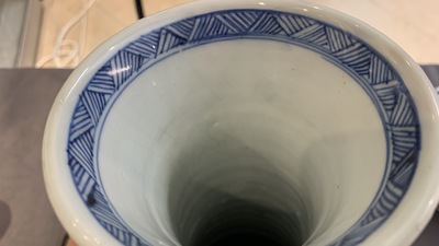 A Chinese blue and white bottle vase with flower arrangements, Kangxi