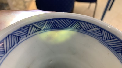 A Chinese blue and white bottle vase with flower arrangements, Kangxi