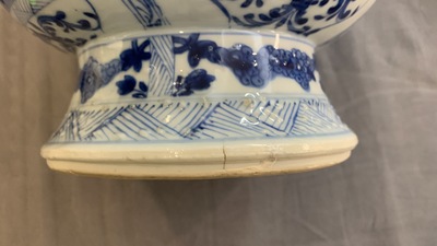 A Chinese blue and white bottle vase with flower arrangements, Kangxi