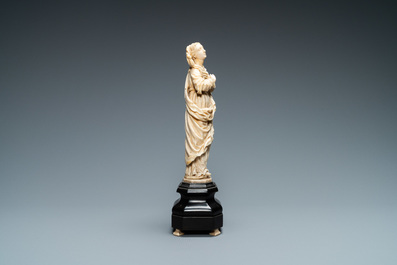 An ivory figure of a Madonna on wooden stand, Flanders or Germany, 17th C.