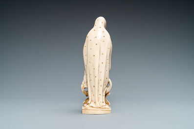 A polychromed and gilded ivory figure of a Madonna, 19th C.