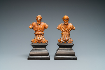A pair of boxwood busts of a saint on an ebony veneer base, 17th C.