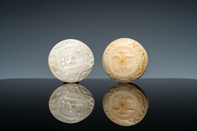 An ivory box and cover with a boy sitting by a water well, 18th C.