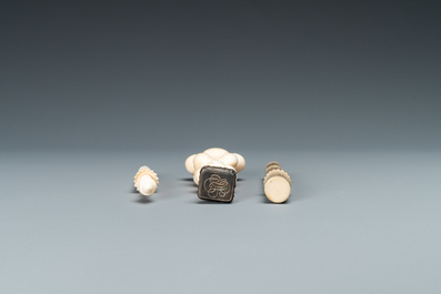 An ivory 'Stanhope' miniature umbrella with microscopical views on Paris, a seal stamp and a bone needle case, 19th C.