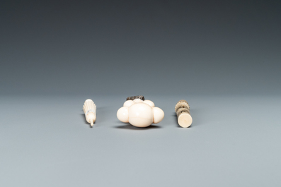An ivory 'Stanhope' miniature umbrella with microscopical views on Paris, a seal stamp and a bone needle case, 19th C.