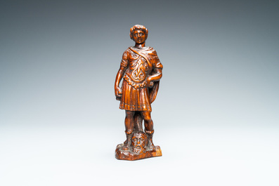 Een palmhouten figuur van David met het hoofd van Goliath, 17e eeuw