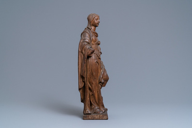 An oak figure of a female saint crushing a griffin, 2nd half 16th C.