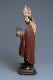 Une grande statue de Saint Amand en bois sculpt&eacute; et polychrom&eacute;, 17&egrave;me
