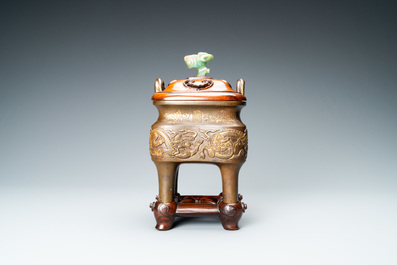 A Chinese partly gilded bronze censer with jade-topped wooden cover, Xuande mark, Kangxi