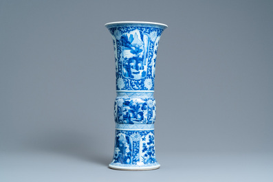 A Chinese blue and white 'gu' vase with floral and lanscape panels, Kangxi