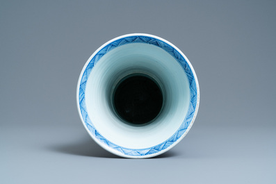 A Chinese blue and white 'gu' vase with floral and lanscape panels, Kangxi