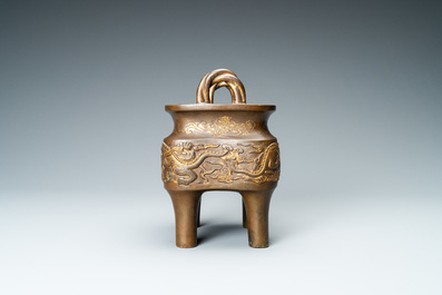 A Chinese partly gilded bronze censer with jade-topped wooden cover, Xuande mark, Kangxi