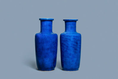 A pair of Chinese monochrome powder blue rouleau vases, Kangxi