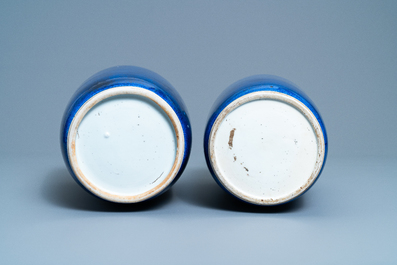 A pair of Chinese monochrome powder blue rouleau vases, Kangxi