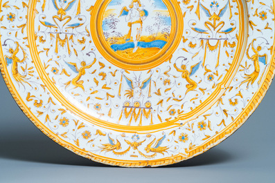 A polychrome 'grotesque' dish with a putto holding an orb, Willem Jansz. Verstraeten, Haarlem, 1645-1655