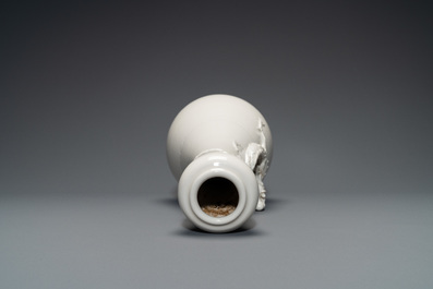 A Chinese Dehua blanc de Chine vase with applied dragon, Kangxi/Yongzheng