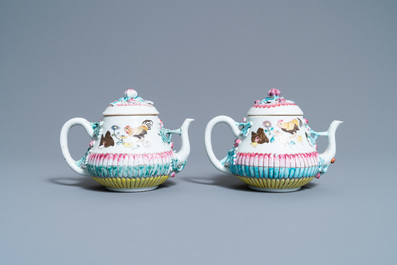 A pair of Chinese famille rose teapots and covers with applied design, Yongzheng